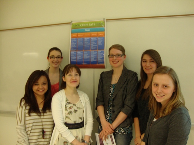 Photo of students around the poster they developed